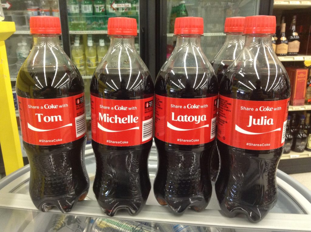 Coca-Cola bottles customised with people's names.