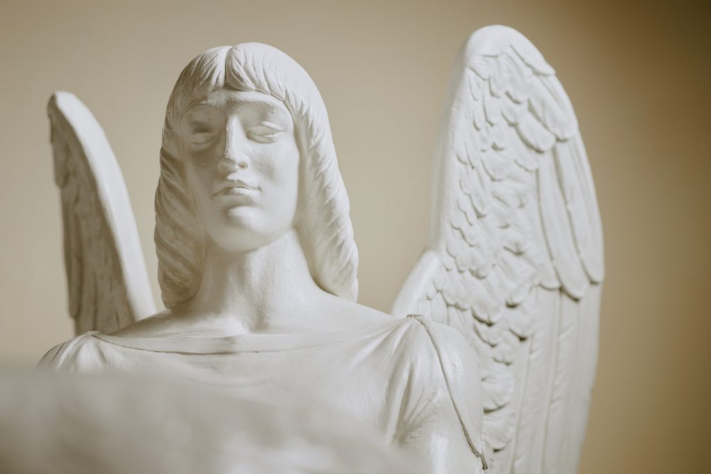 A white marble angel statue 