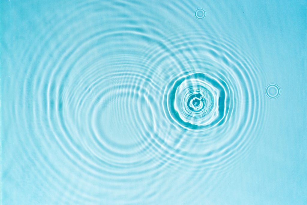 A ripple in light blue water