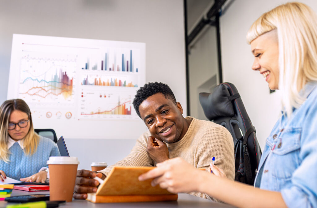 Diverse group of young business people working on new project