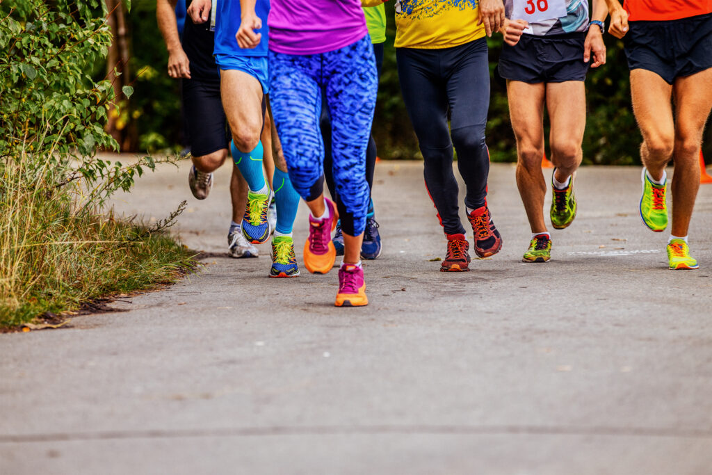 The legs of men and women running for exercise